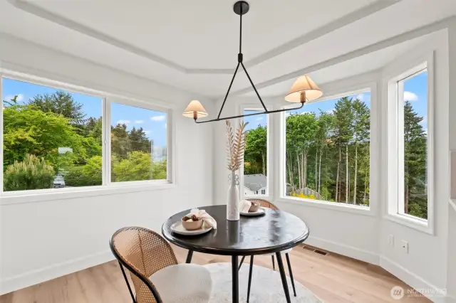 Kitchen nook surrounded by windows and light!
