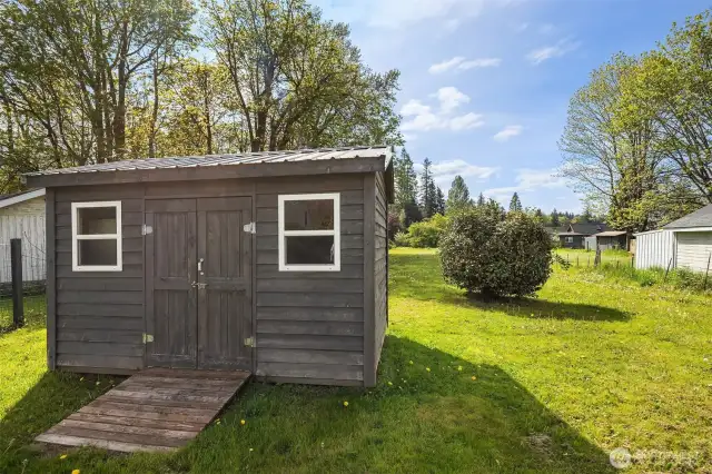 Enjoy the versatility of a detached storage building or workshop—ideal for hobbies, storage, or creative space. Ample parking, including room for your RV.