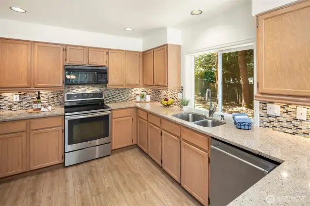 Stone counter and stainless appliances.