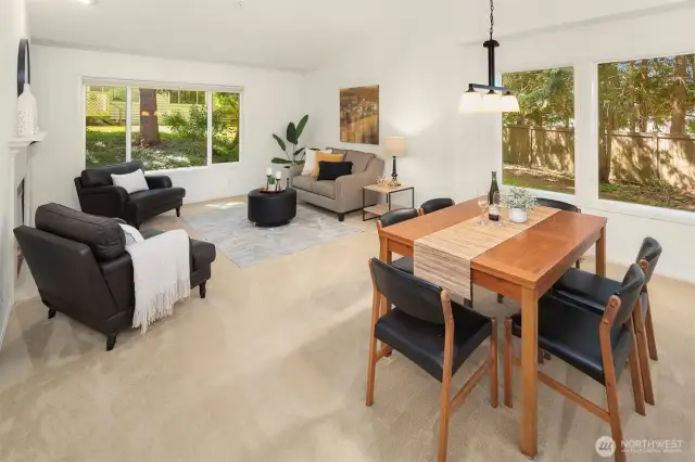 Large living room / dining room with vaulted ceiling.
