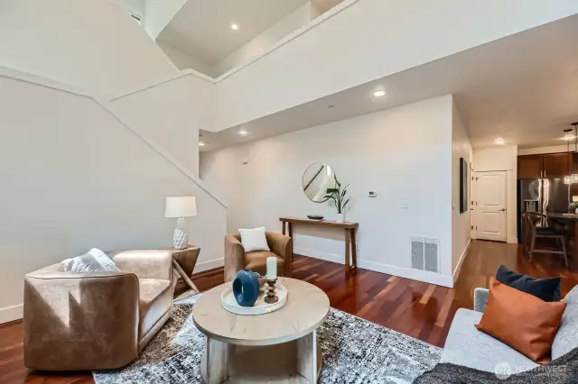 Open floorplan! Great room flows into sleek kitchen, dining area and joins the open 2nd story above.