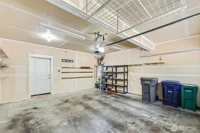 2 Car garage with storage in the rafters.
