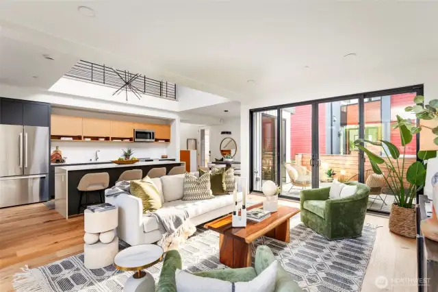 The interiors are adorned with natural wood finishes, wide plank hickory hardwood floors, and stylish quartz counters, creating a modern and inviting atmosphere.