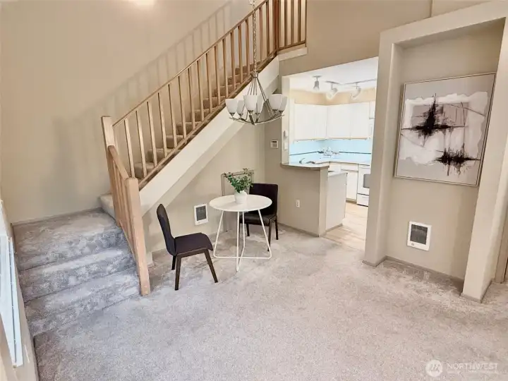 Cathedral ceiling over dining area and access to 2nd bedroom and full bath upstairs