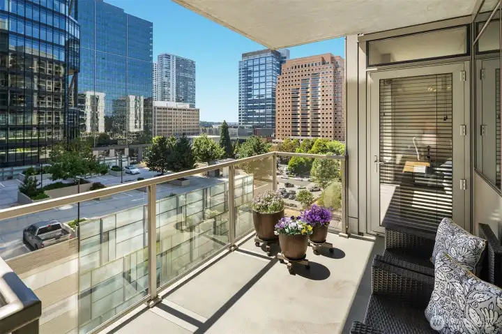 The balcony can be accessed from the dining room as well as the Primary Bedroom. This view is looking west.