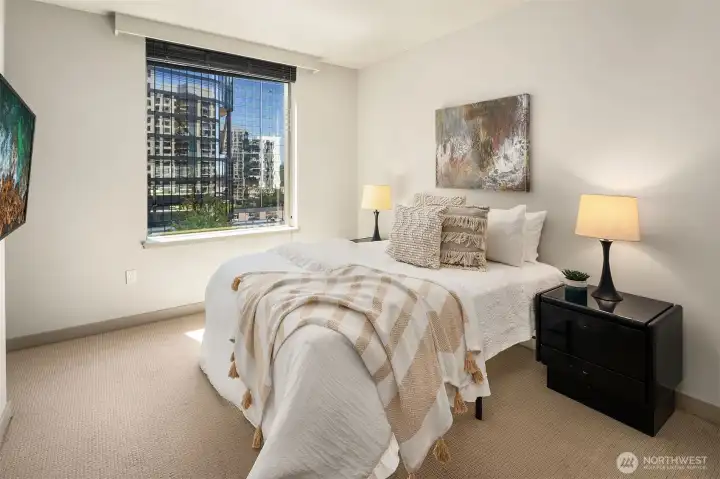 The primary bedroom with city view.