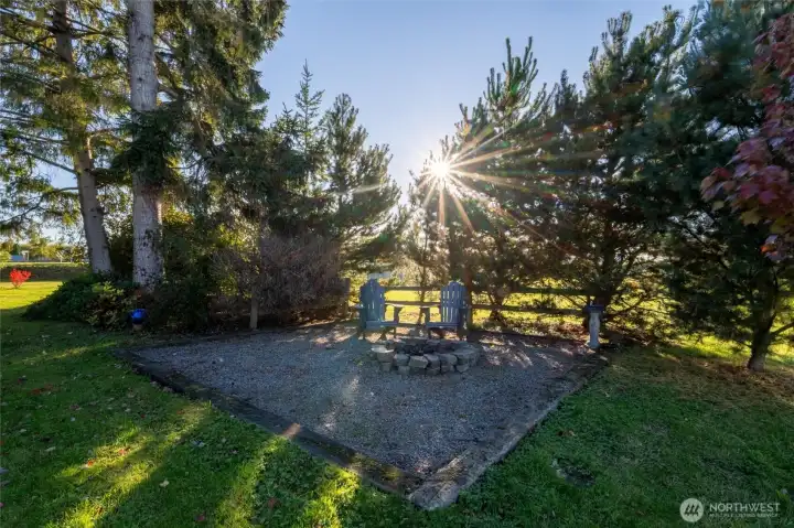 Cozy up to the fire pit behind the home.