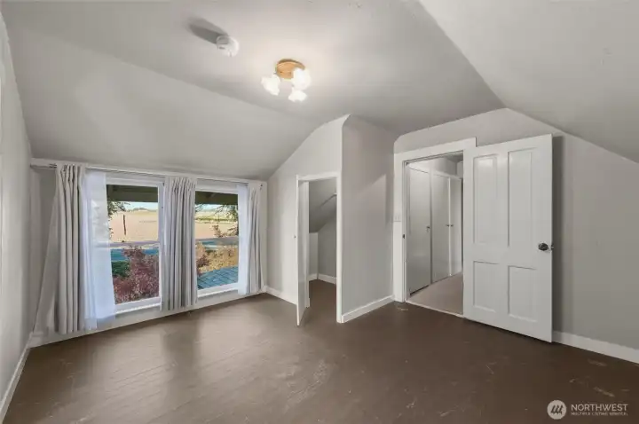 Great bonus space upstairs with views looking east.  Door on right leads to the stairs, bedroom and unfinished half bathroom.