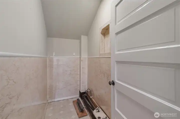 Unfinished 1/2 bathroom located between the two bedrooms.