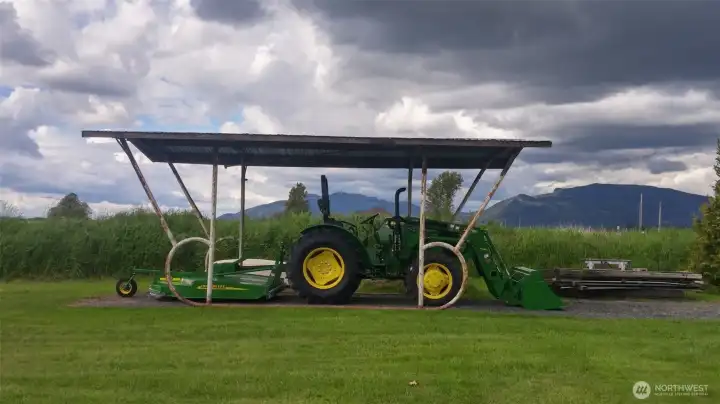 This cover currently has a trailer parked under it but was used in the past for their tractor.