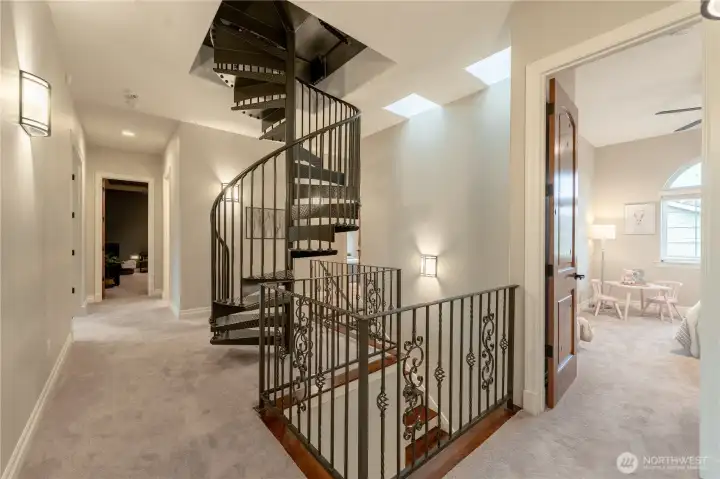 Second floor, Spiral stairs lead to roof top deck.