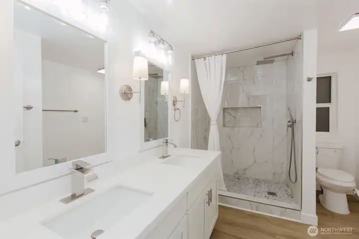 Fully updated primary bathroom with easy access shower.