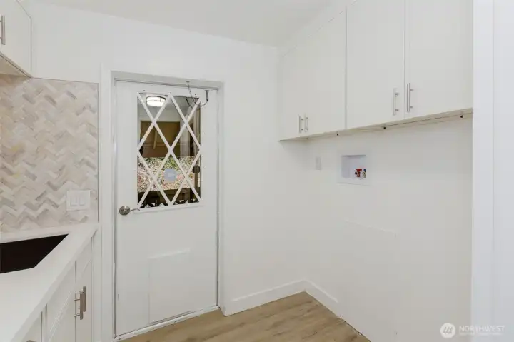 Laundry room with plenty of storage.