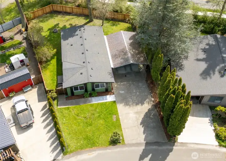 Street view showing quiet residential setting, with a well maintained large back and front yard with plenty of room to landscape to your hearts desire.