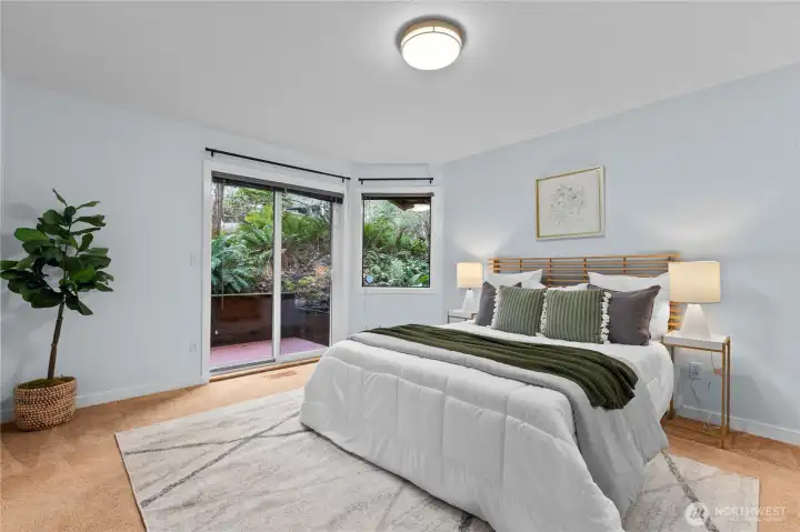 Primary bedroom with sliding glass door, and exterior access