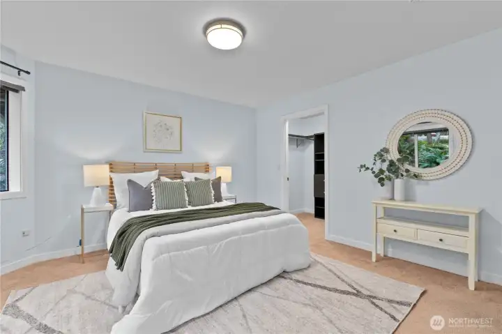 Primary bedroom with en suite bathroom and walk-in closet