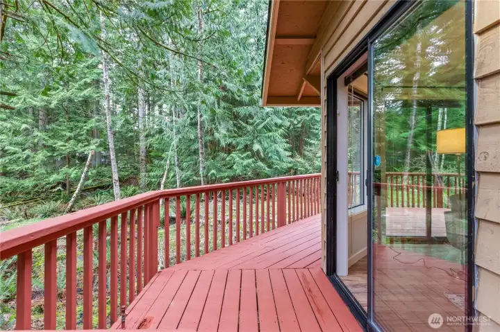 Enjoy the peace and quiet of the wooded surroundings from your wrap around deck