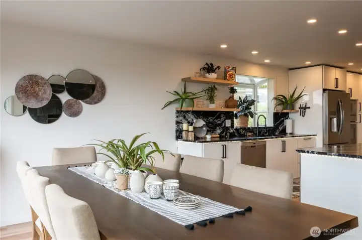 Spacious and bright dining area offers amazing views and direct access to the expansive deck. Perfect for entertaining!