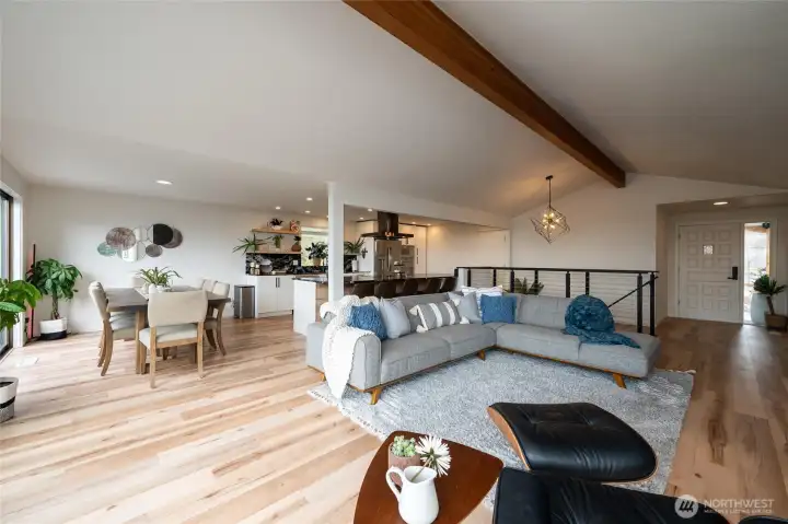 Beautiful wood flooring and vaulted ceilings with exposed beams.