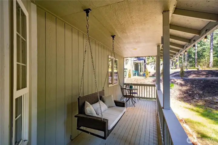 Large front porch with bench swing