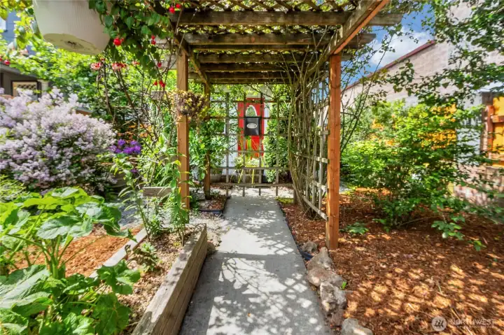 With a whimsical oasis in your front yard, you feel as if your in a world of your own! Blueberry bushes and plum trees are welcomed additions!
