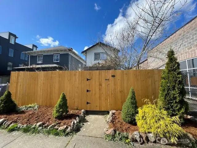 New cedar fence lines the perimeter of your home!