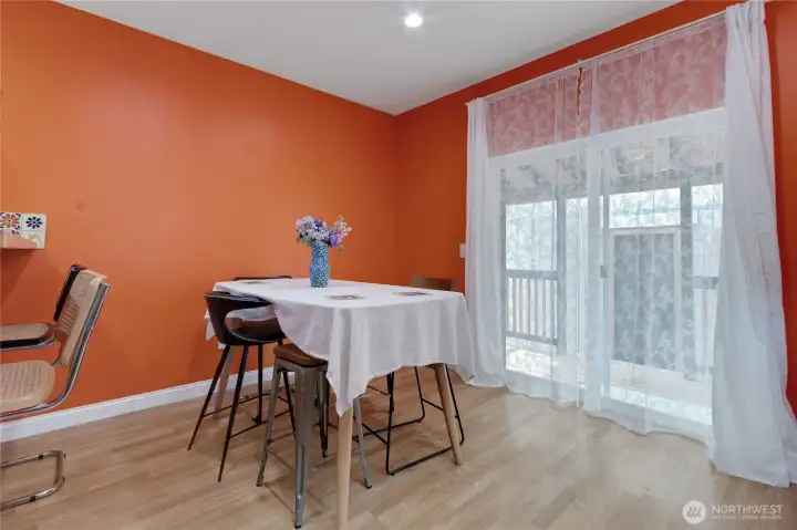 Dining room area just off from the kitchen, covered back deck just beyond the slider!