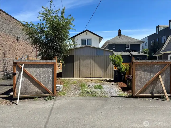Use existing concrete pad to build your very own DADU, double gates open into alley. Should be enough space for 2 parking spaces.