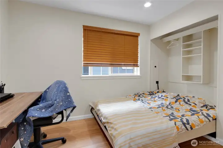 Bedroom 2 has a built-in murphy bed with closet storage and space to work from home!