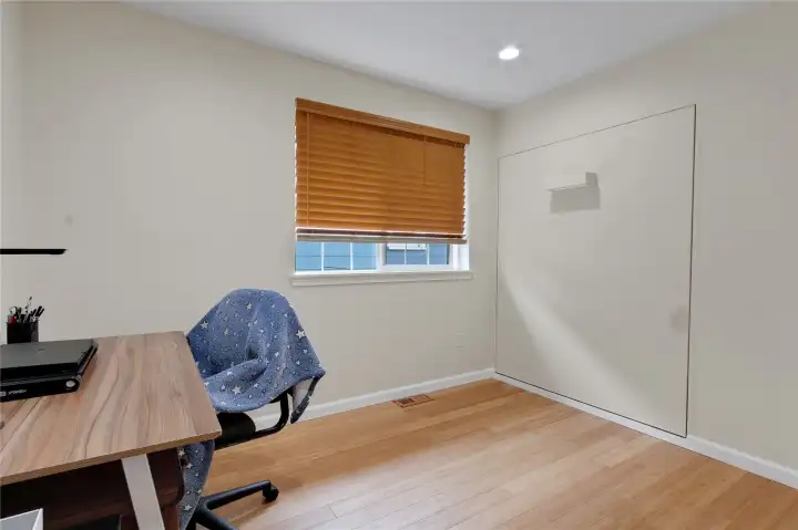Murphy bed folds up into the wall, and in an instant, you have more space!