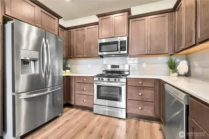 Chef-inspired kitchen with stainless appliances.