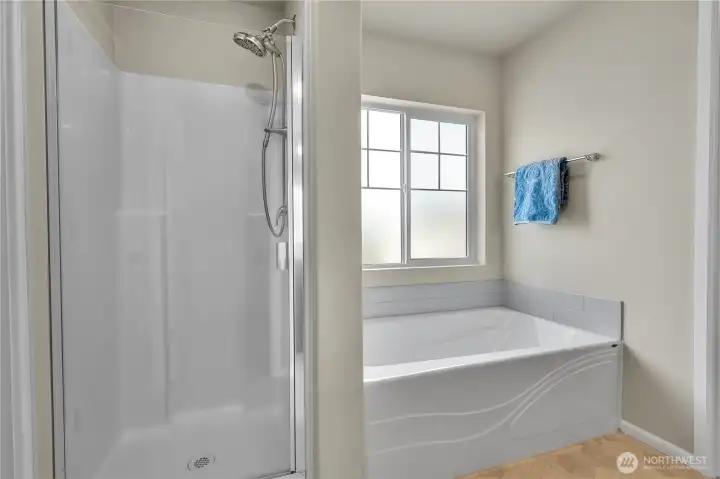 Roomy full bathroom with a water closet for privacy.