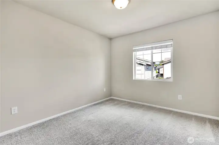 Welcoming secondary bedroom.
