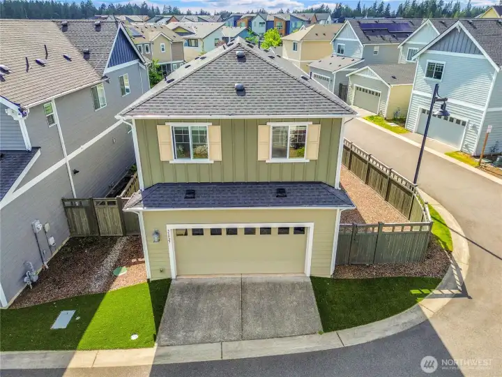 Low-maintenance living with turf in the backyard.