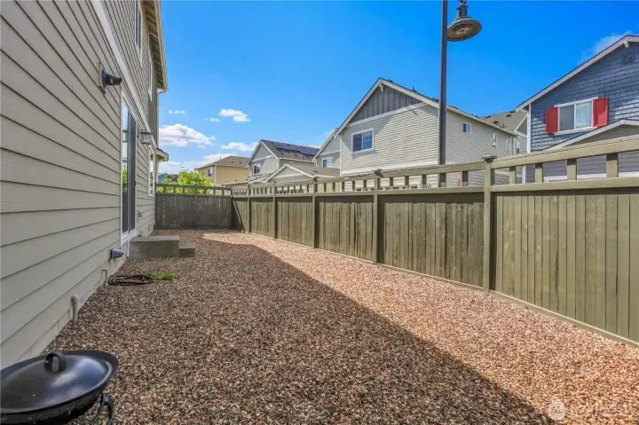 Enjoy your private fenced side yard, add a fire pit...