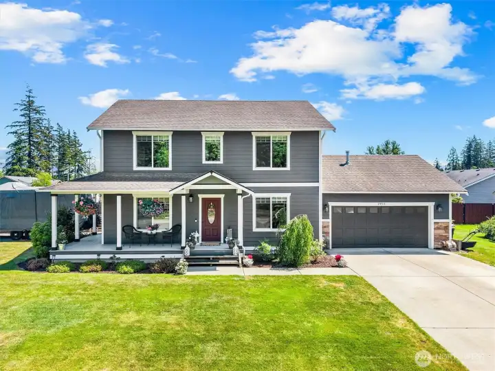 Picture perfect with a charming wrap around porch.