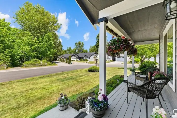 The front porch you've always wanted - perfect for morning coffee, evening conversations, and everything in between.