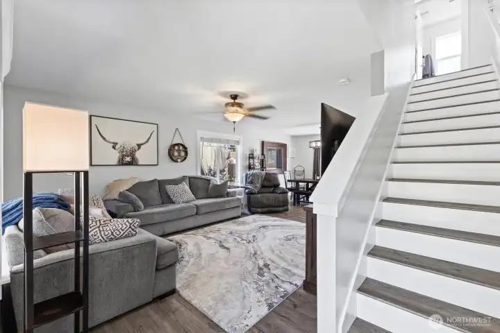 Step inside to an inviting open-concept floor plan featuring beautiful flooring and abundant natural light.