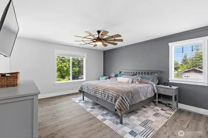 The primary bedroom feels bright, spacious, and relaxing - exactly what you want in an owner's suite.