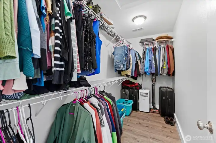 Designed with organization in mind, this spacious closet offers plenty of room for every season and every wardrobe.