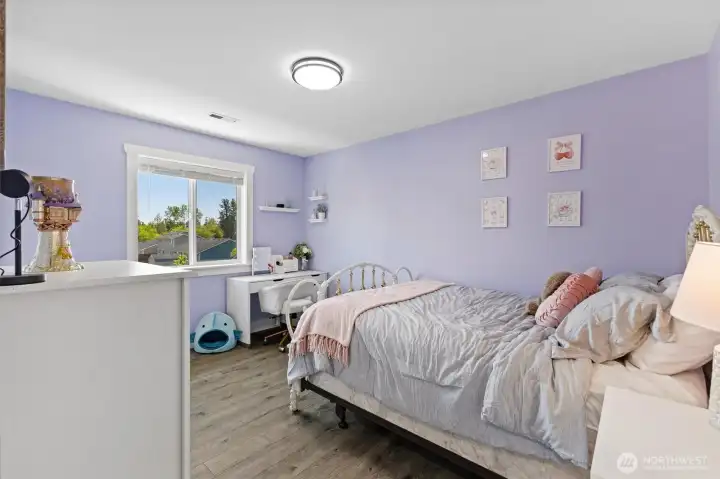 Third bedroom with views to the backyard.