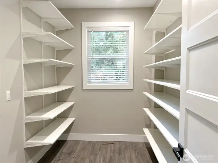 Walk-in pantry with space for an additional refrigerator and freezer