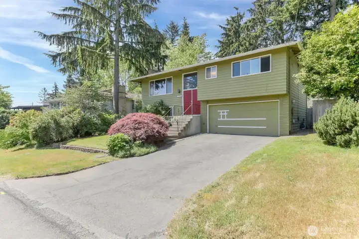 Located in a beautiful North Hill neighborhood this home this home has a welcome home presence.