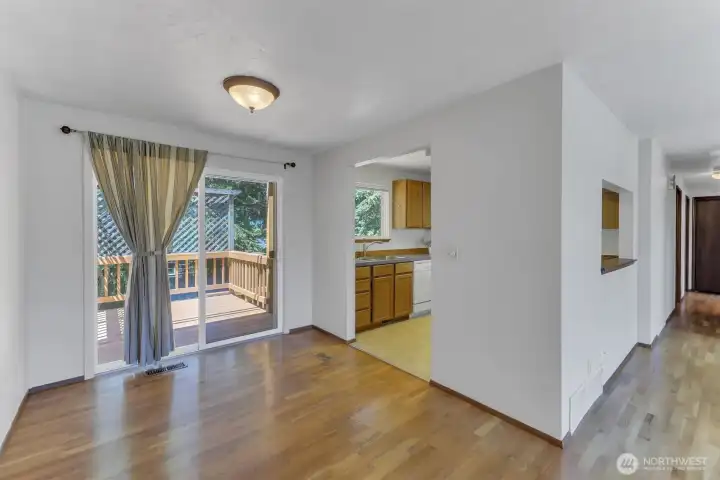 The dining room gives easy access to the large deck and welcomes in the sunshine.