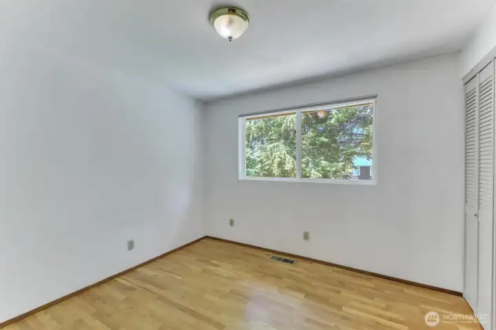 Thei first of 3 bedrooms also enjoys the hard wood floors.