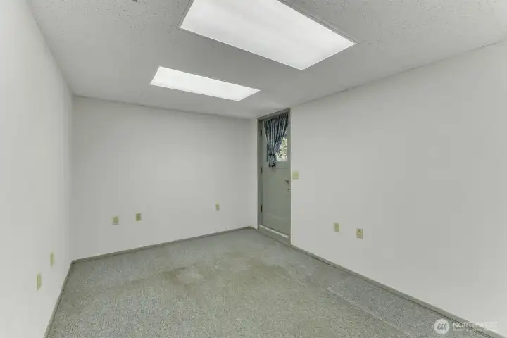 Just off the recroom is a flex room that also gives access to the back yard.