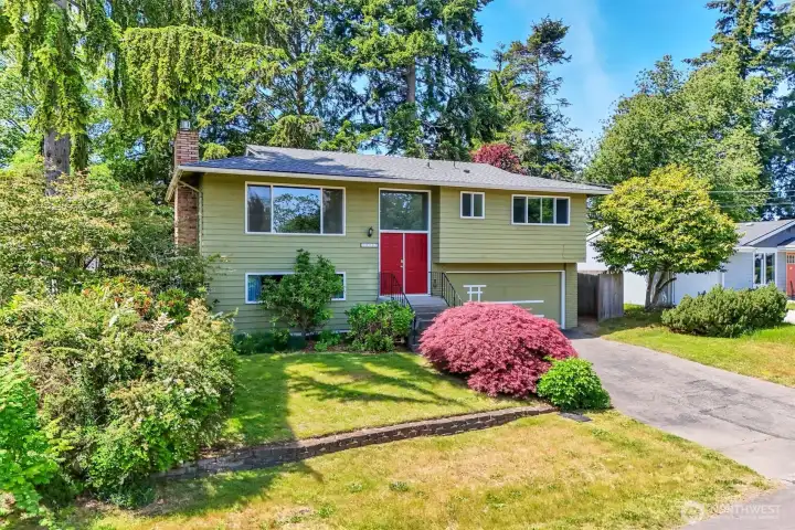 Mature landscaping give this home a cozy charm.