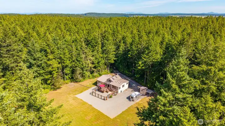 5 beautiful acres with additional building areas for future planning.
