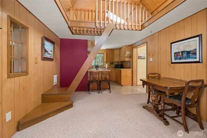 Step into the living room with an additional sleeping loft above the kitchen.