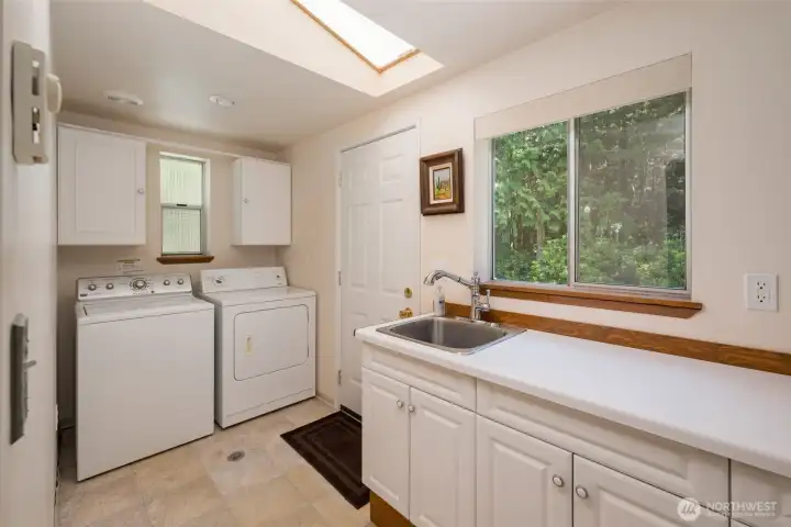 A front laundry room and utility sink bring all the creature comforts to the cottage.